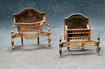 A matched pair of Adam style brass and cast iron fire grates