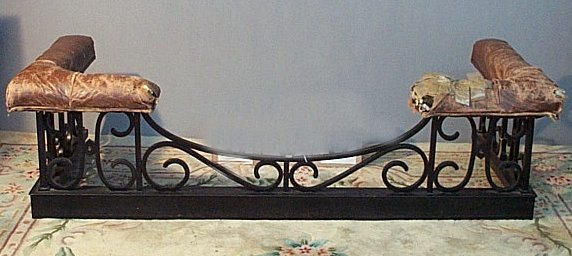 A cast iron black painted club fender