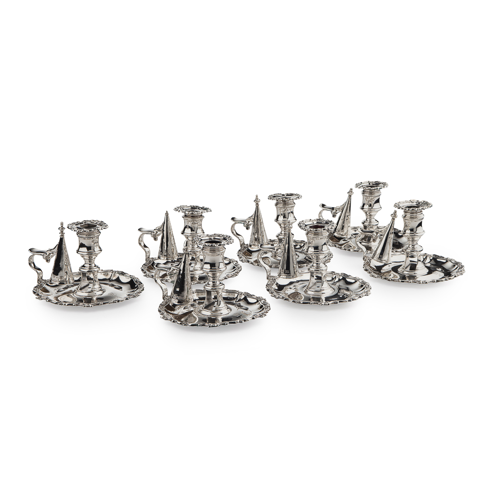 A set of seven George IV silver chamber-sticks