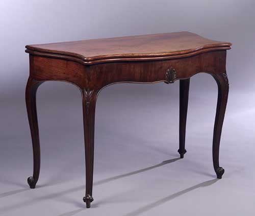 A George III mahogany foldover tea table