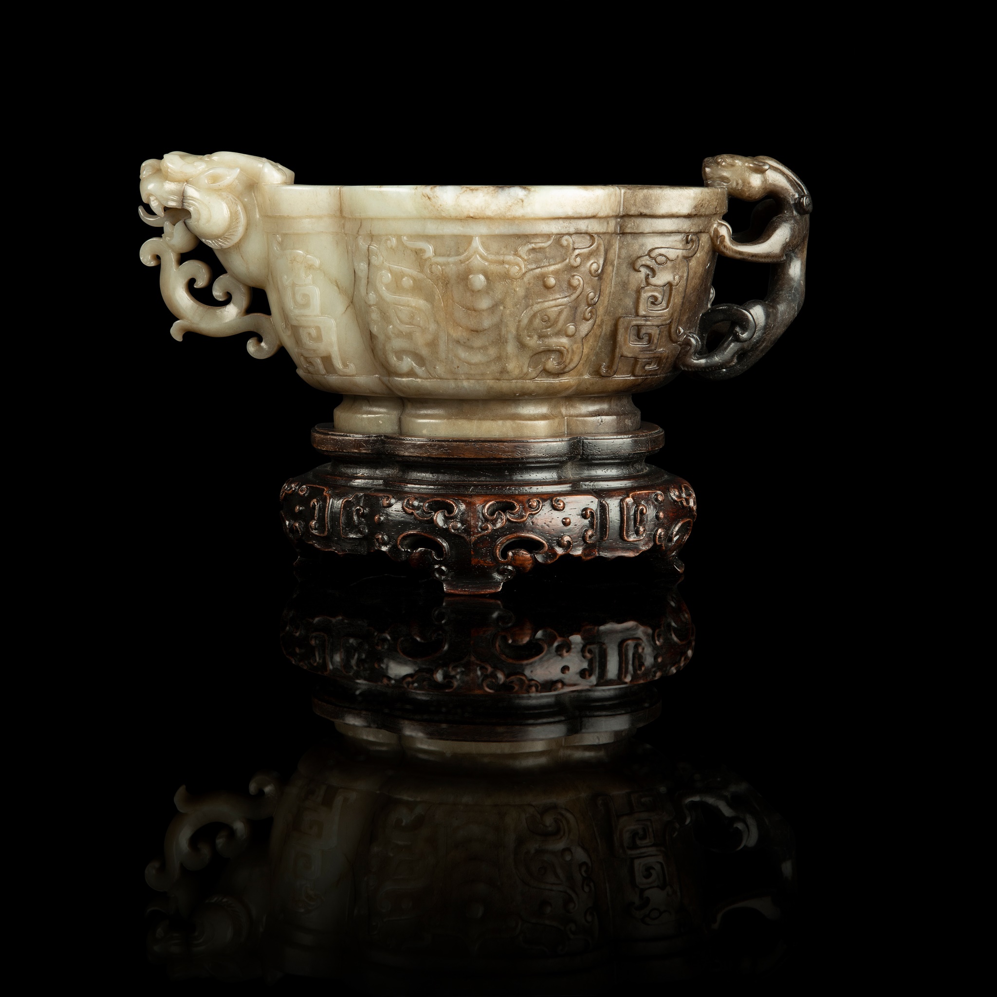 WHITE AND RUSSET JADE 'TAOTIE' CUP WITH DRAGON AND CHILONG HANDLES