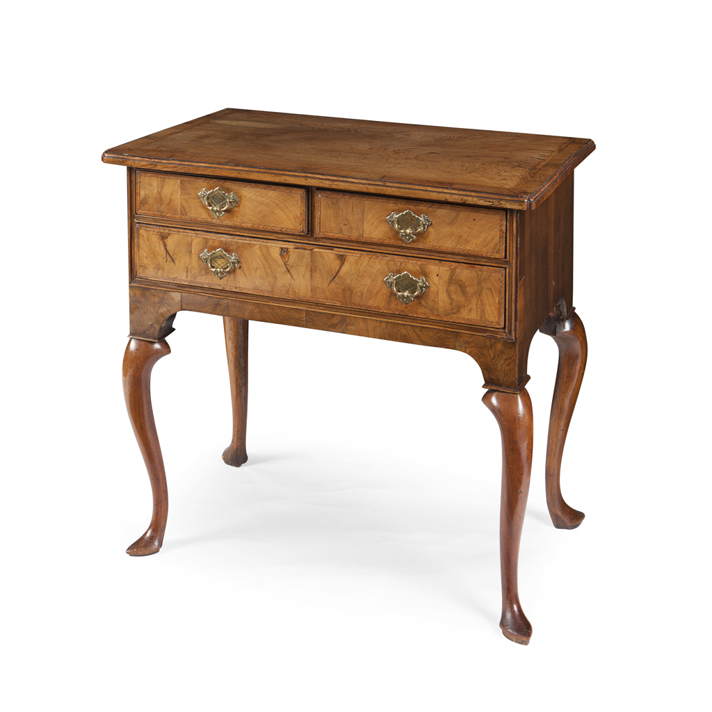 A GEORGE II WALNUT AND FEATHERBANDED LOWBOY