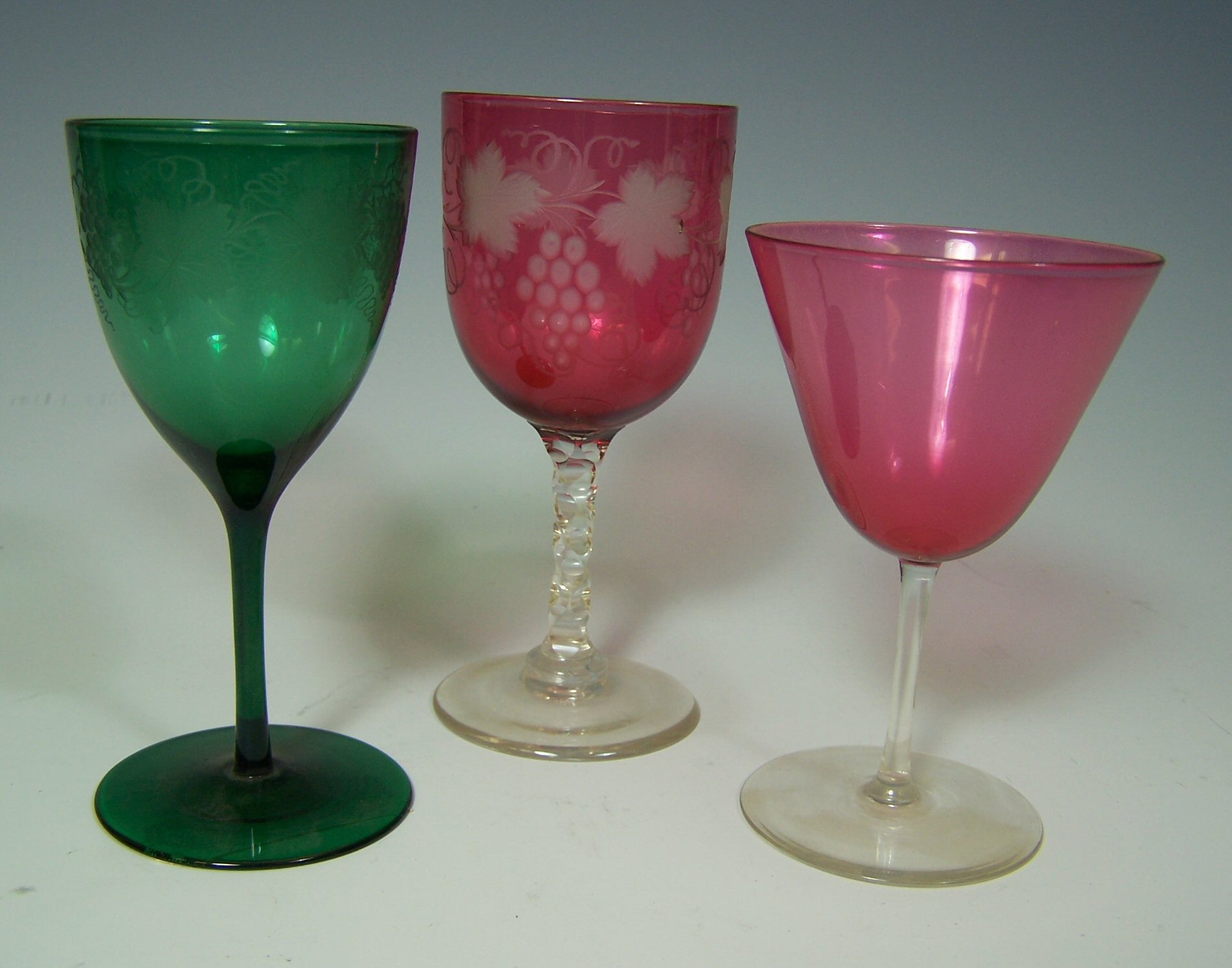 A set of eleven green glass goblets