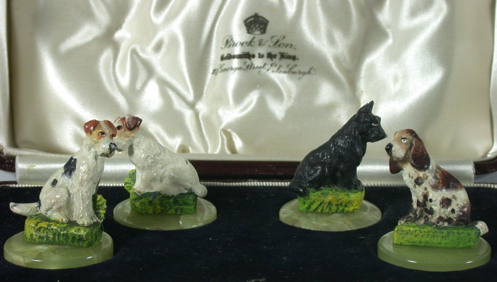 A cased set of four novelty menu cold painted bronze holders