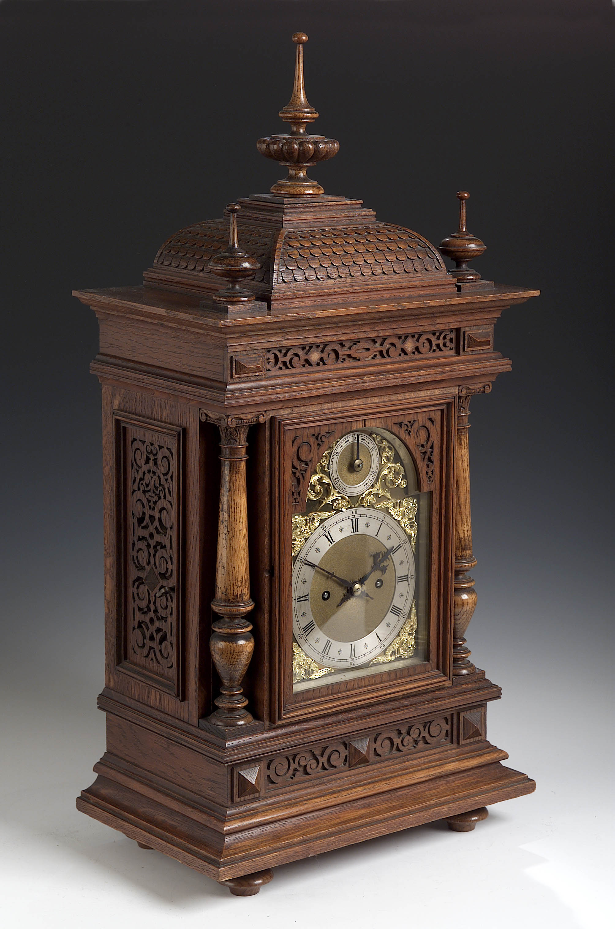 A 19th century oak quarter repeating bracket clock