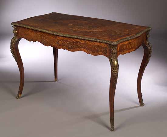 A 19th century French elm, mahogany and marquetry inlaid writing table