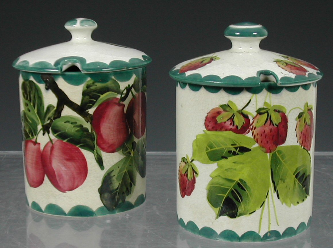 Two Wemyss preserve jars and covers,