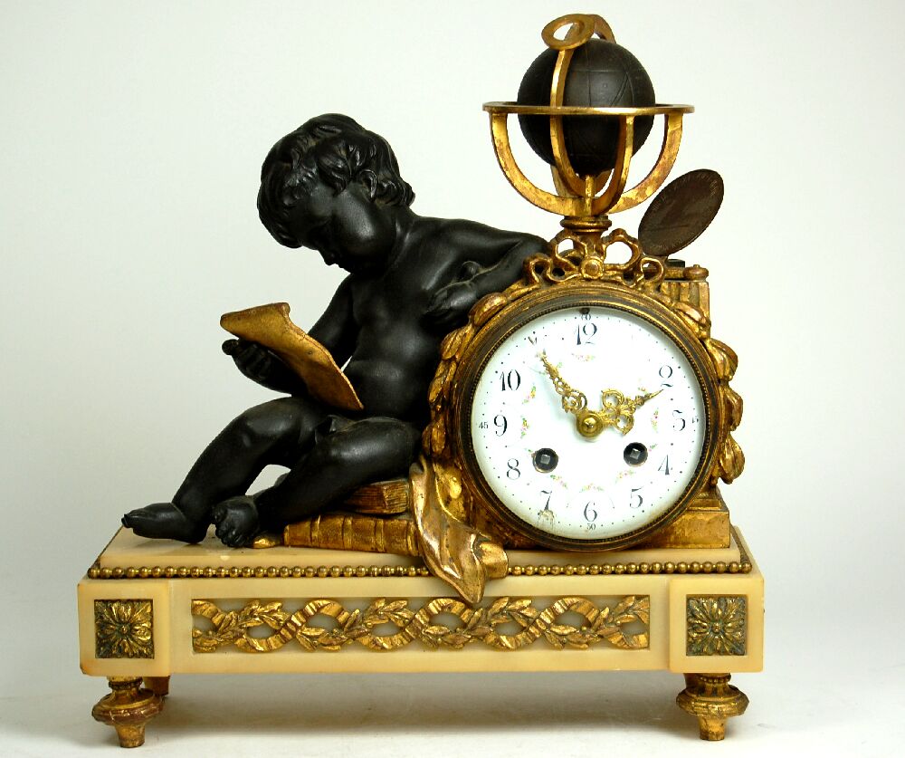 LOUIS XVI STYLE GILT AND PATINATED BRONZE CLOCK