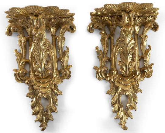 A pair of carved giltwood wall brackets