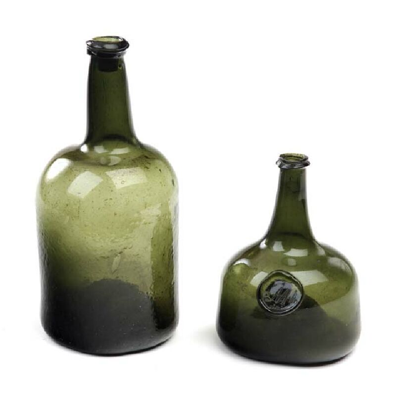 An 18th century green glass wine bottle
