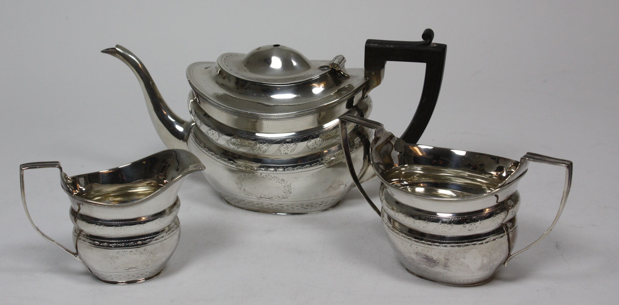 A matched Edwardian three piece tea set