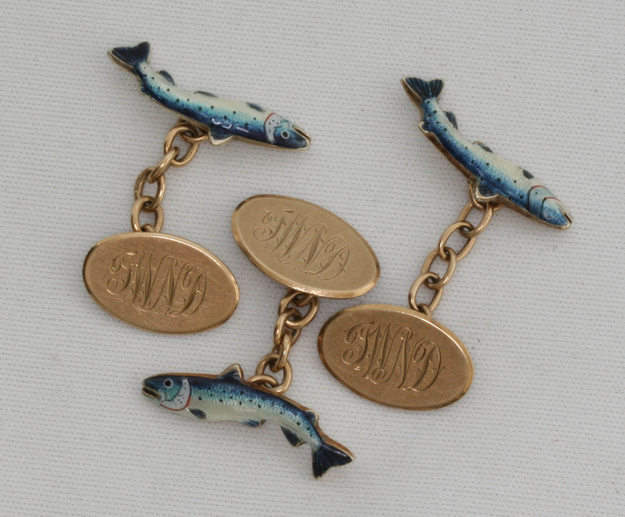 ANGLING INTEREST; A group of three 9ct gold enamel cufflinks