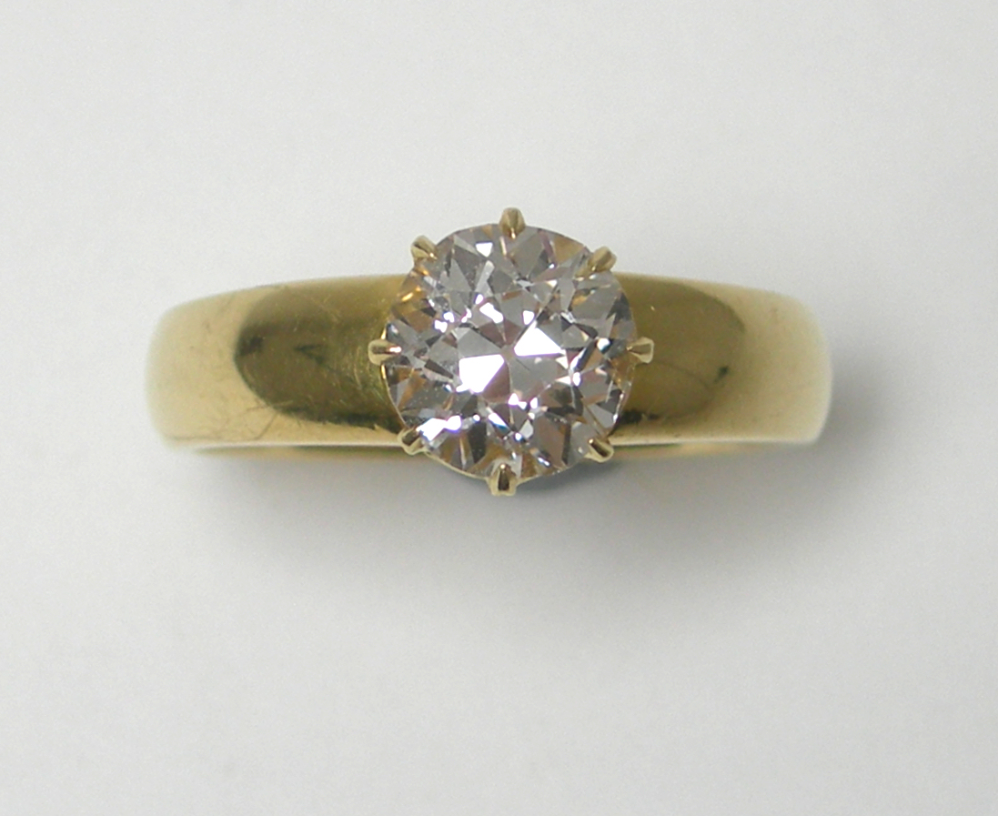 An 18ct gold mounted diamond single-stone ring