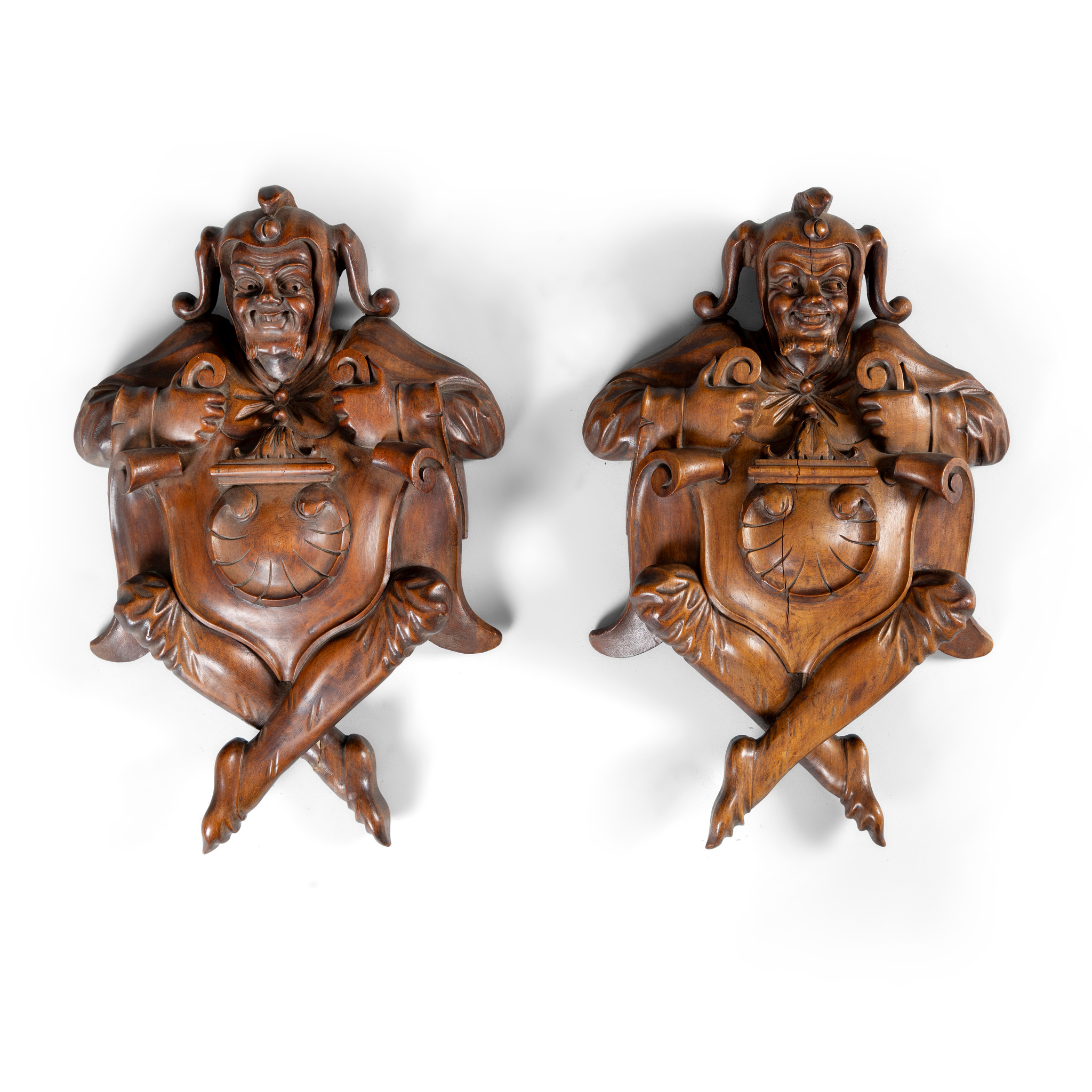 A PAIR OF OAK WALL PLAQUES