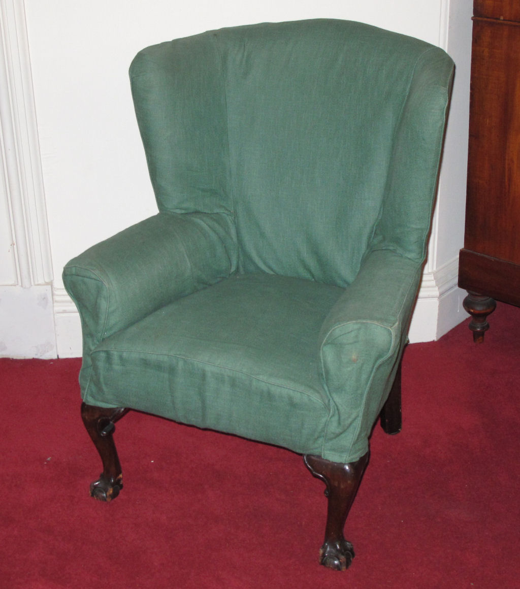 A 19th century mahogany wingback armchair