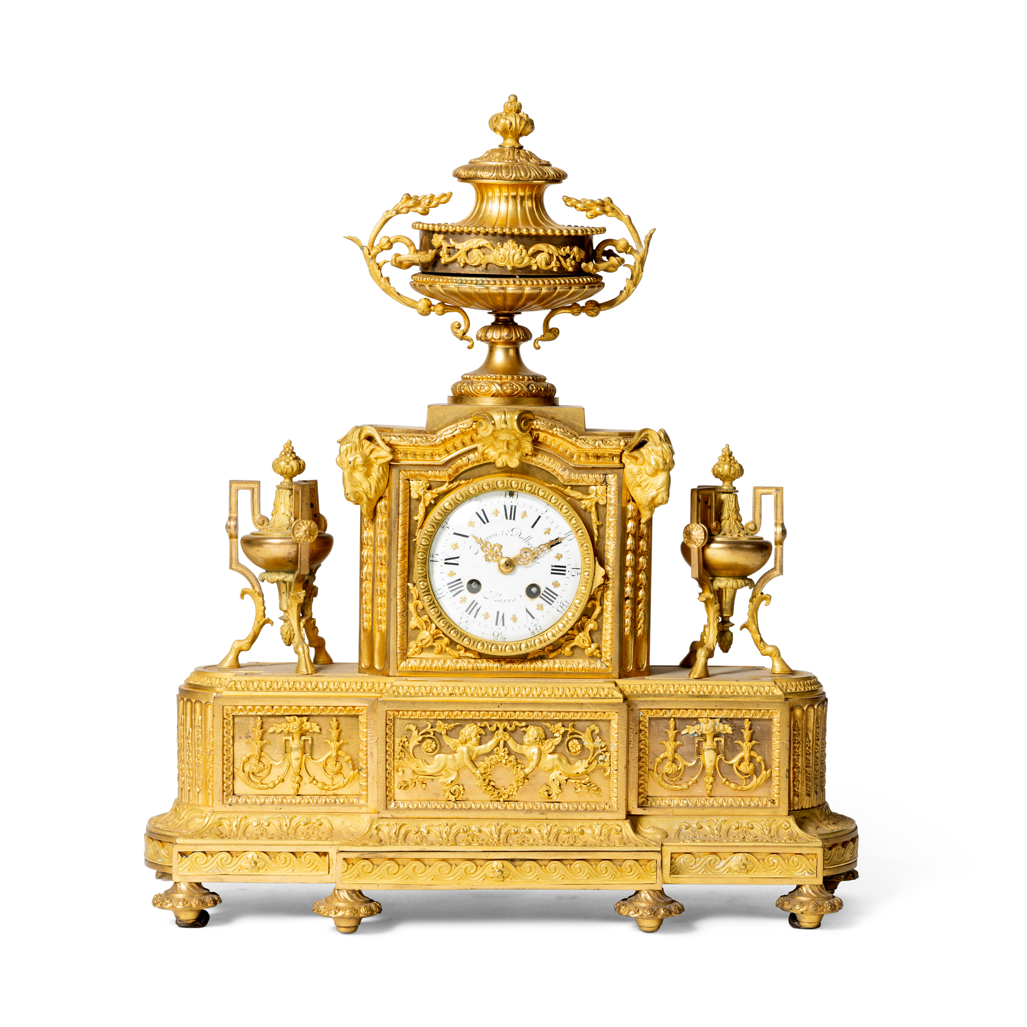 A FRENCH GILT METAL MANTEL CLOCK