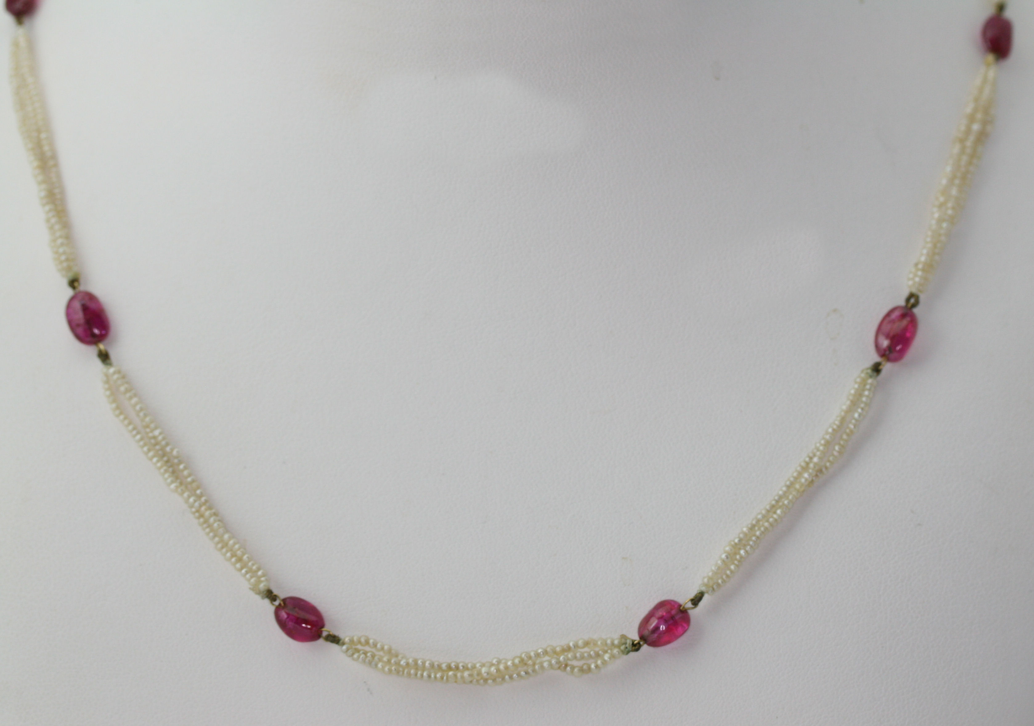 A seed pearl and ruby necklace