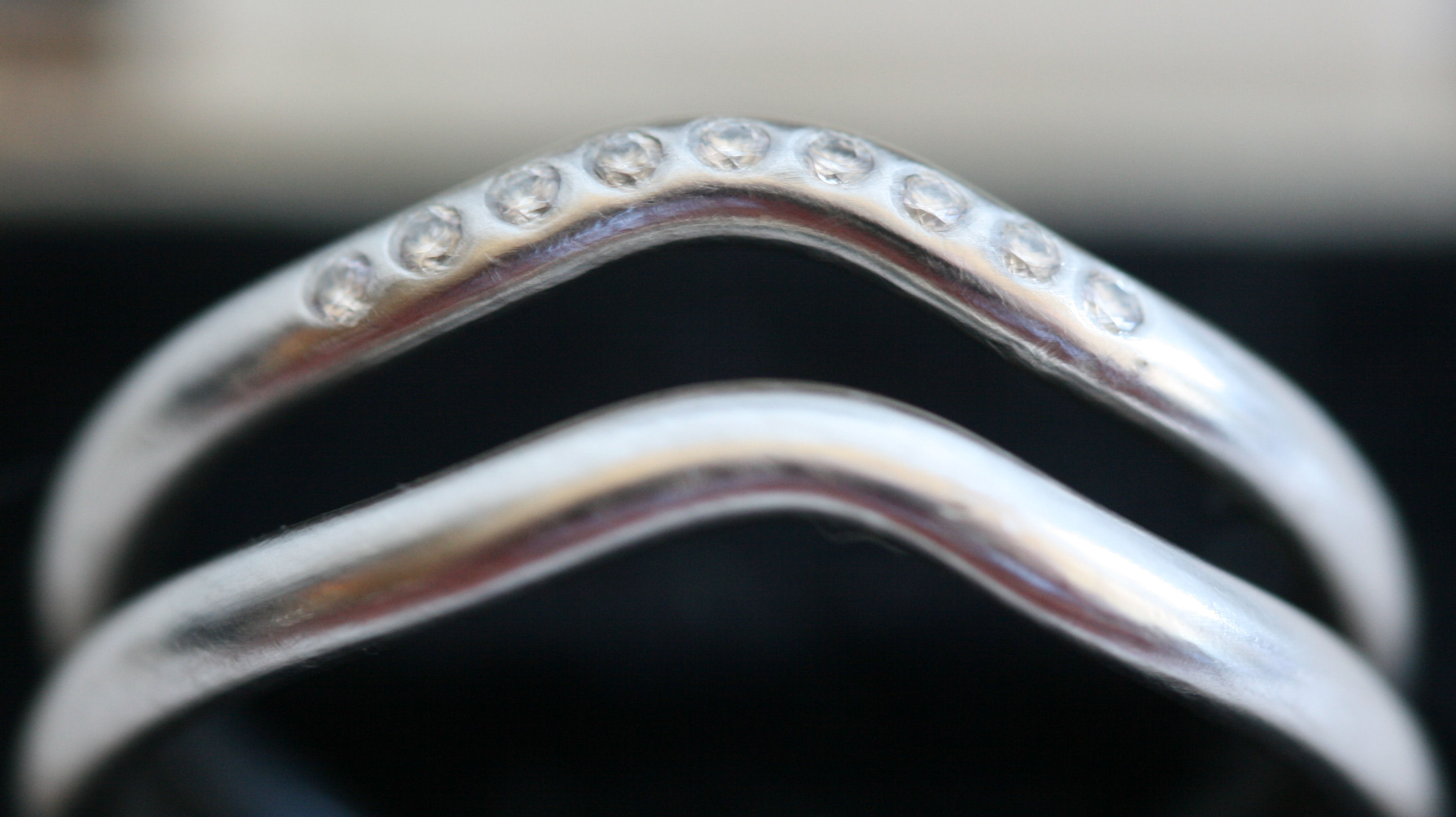 TIFFANY & CO. - a Peretti platinum wedding band and matching diamond set half-eternity ring,