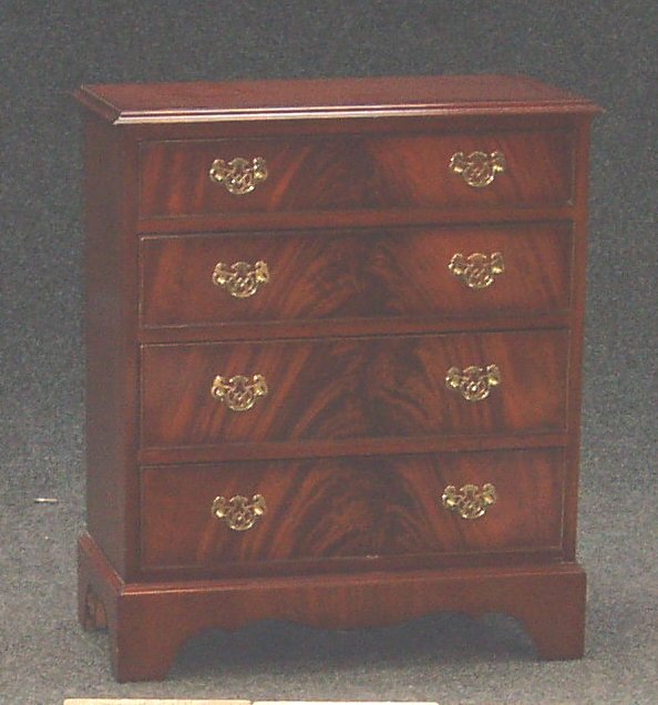 A small reproduction mahogany chest,