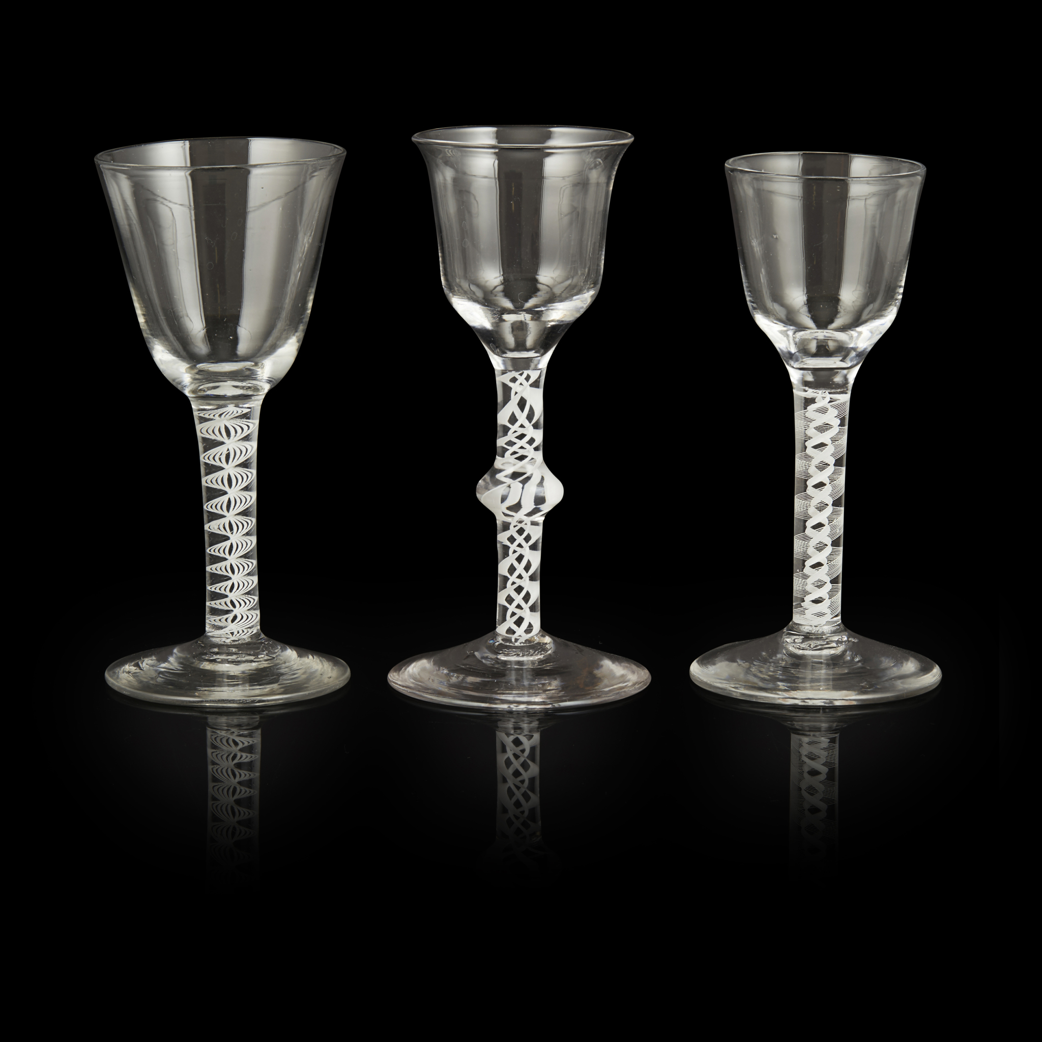 THREE GEORGIAN OPAQUE TWIST STEM WINE GLASSES