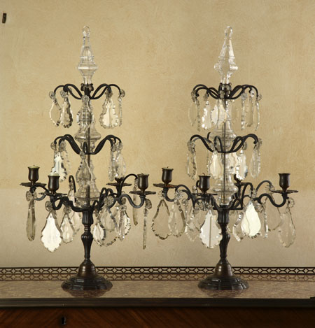 A pair of bronzed metal and cut glass lustres