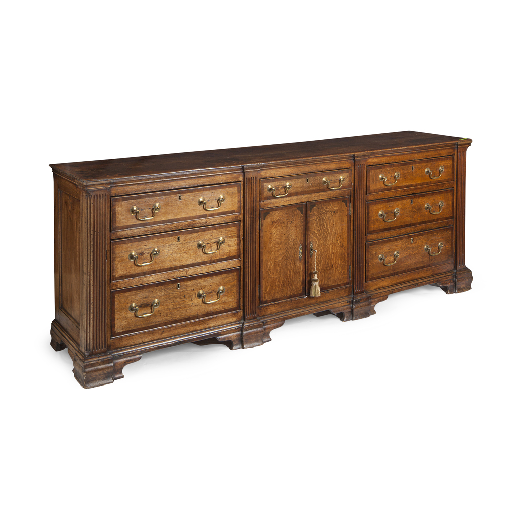 A GEORGE III OAK AND MAHOGANY BANDED DRESSER