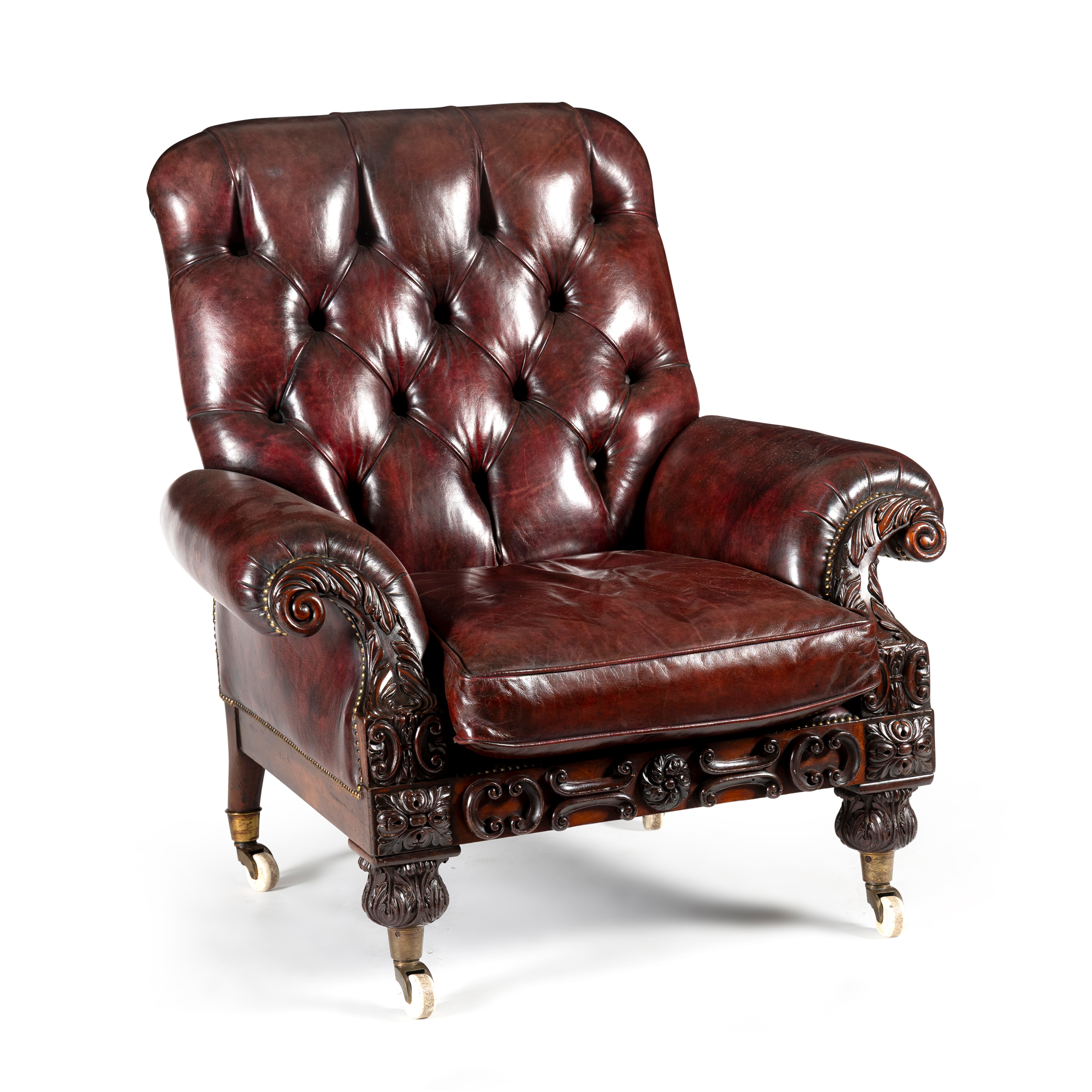 A VICTORIAN MAHOGANY AND RED LEATHER ARMCHAIR