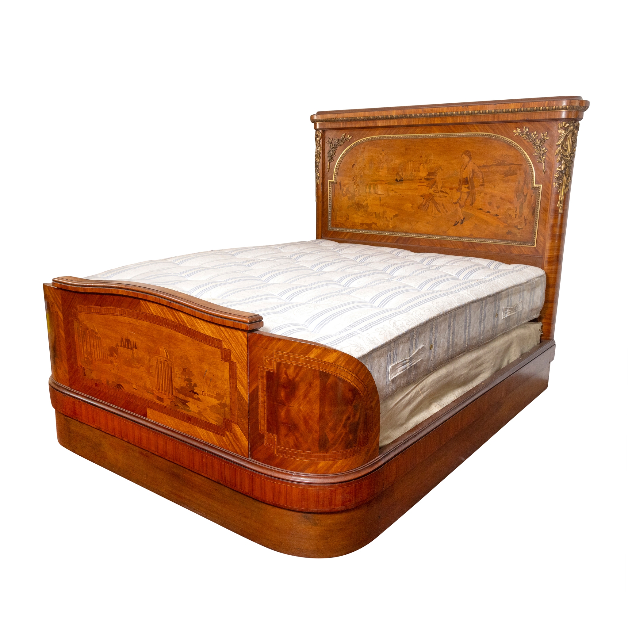 A FRENCH MAHOGANY AND GILT METAL MOUNTED BED