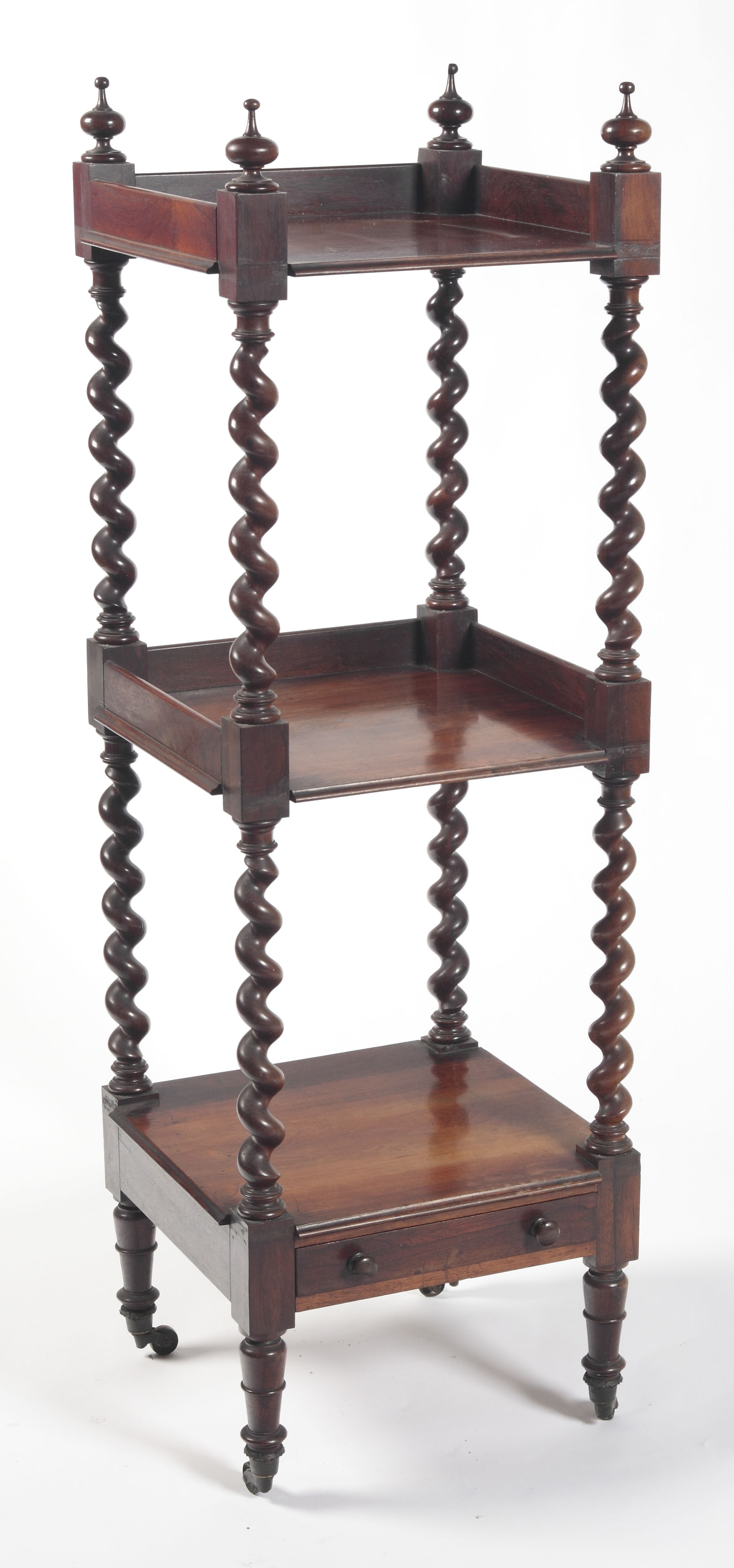 A Victorian rosewood three tier whatnot