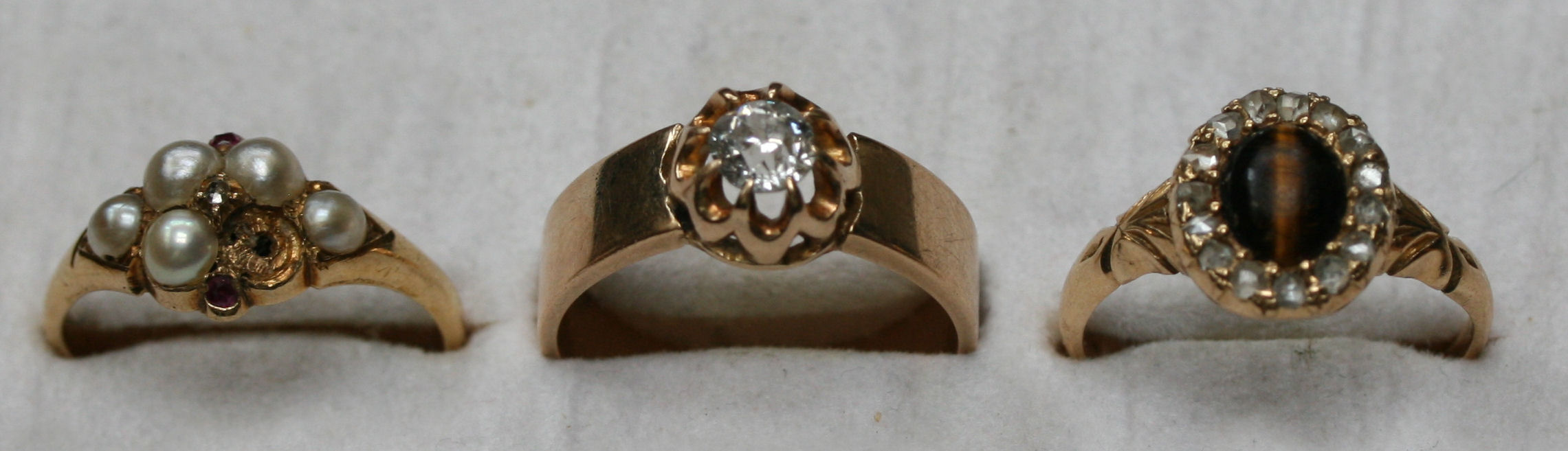A group of three diamond and other gem set rings