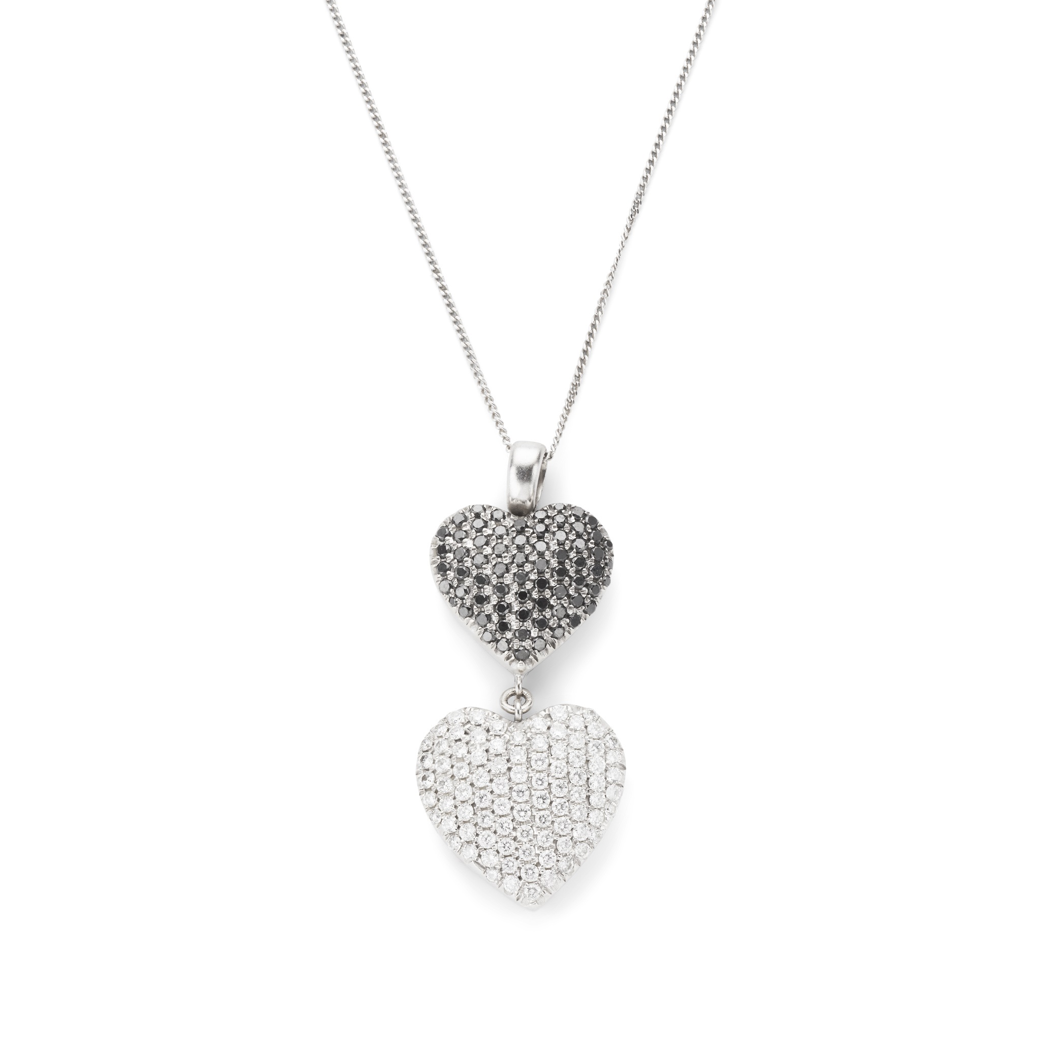 A black and colourless diamond heart pendant