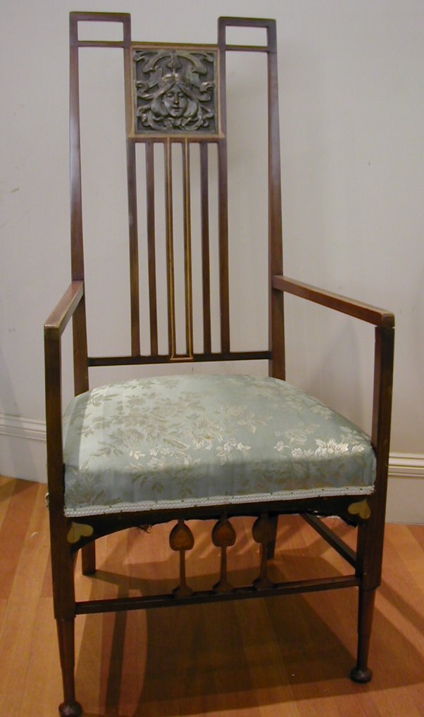 An Art Nouveau mahogany and inlaid armchair