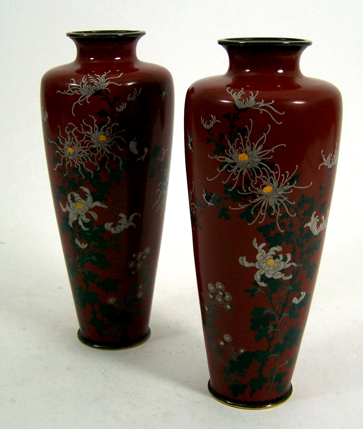 A pair of Japanese cloisonne baluster shaped vases,