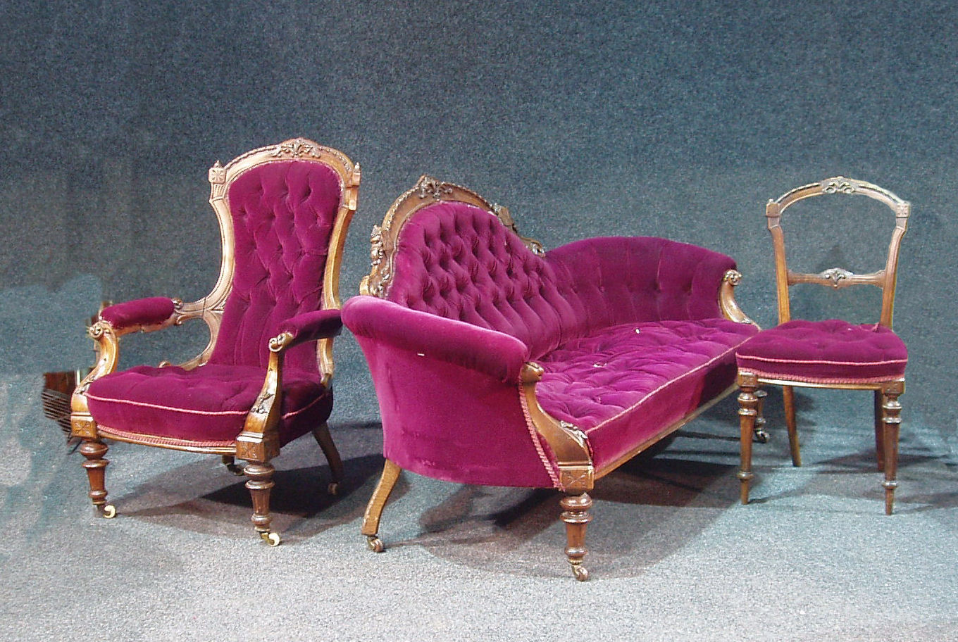 A Victorian walnut upholstered parlour suite