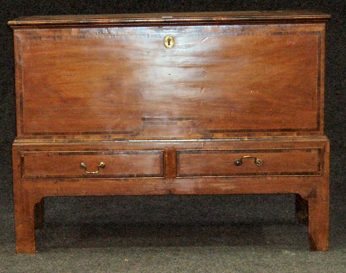 A walnut and cross banded mule chest on stand,
