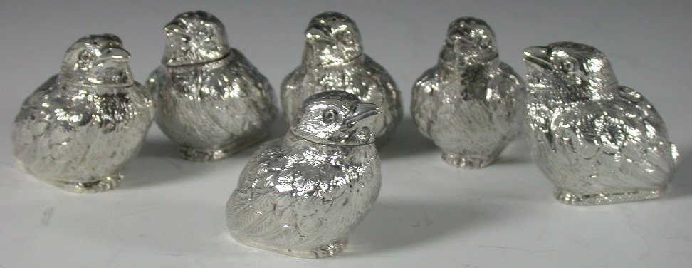 A set of six Edwardian silver novelty pepperettes