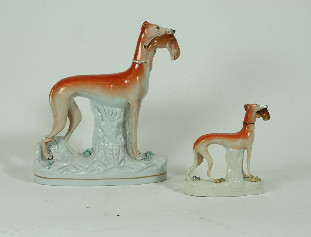 A pair of late 19th century/ early 20th century Staffordshire greyhounds