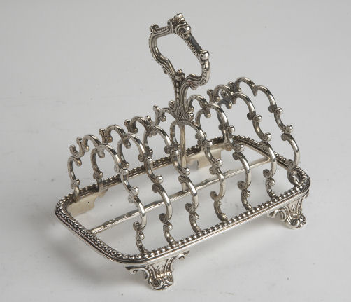 A Victorian six division silver toast rack