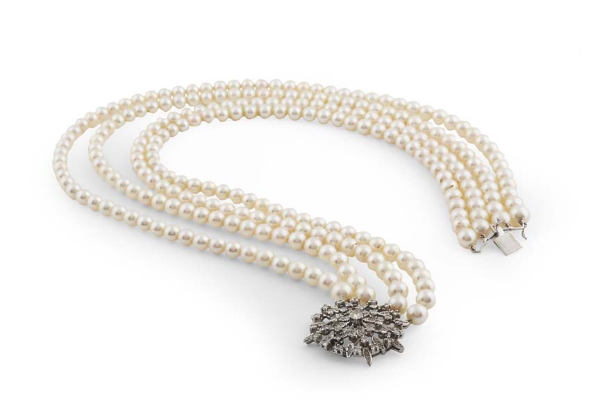 A cultured pearl necklace with diamond clasp