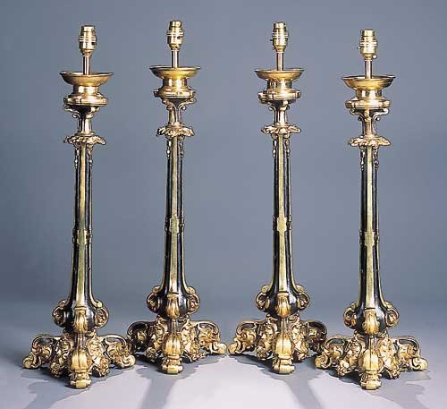 A set of four part bronzed brass lamp stands