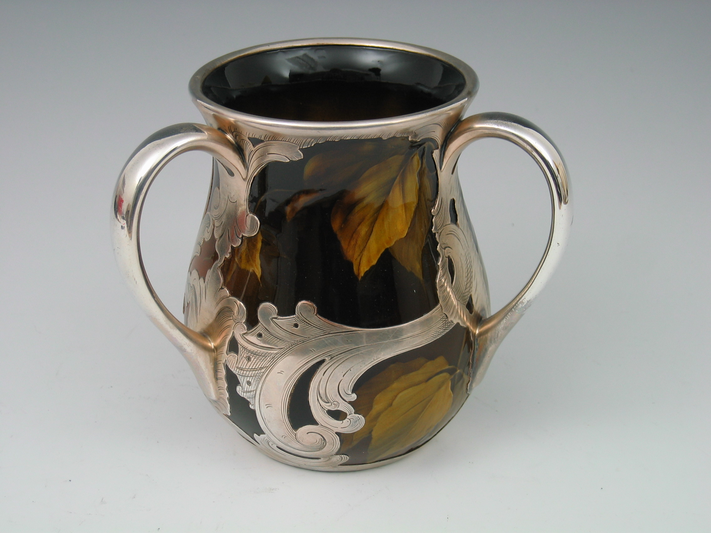 A Rookwood silver mounted three handled tyg,