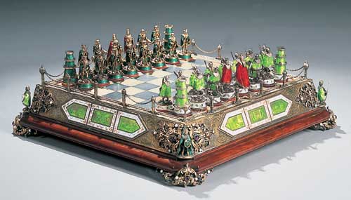 A Viennese white metal, gilt and enamelled chess set,