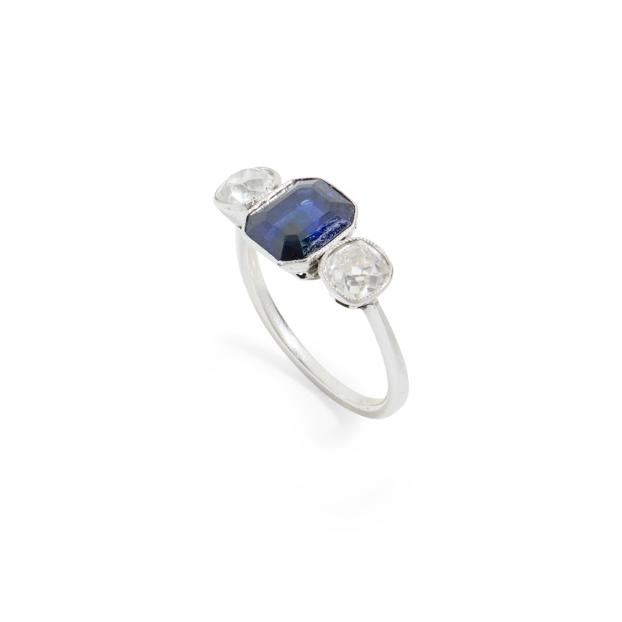 A sapphire and diamond three-stone ring