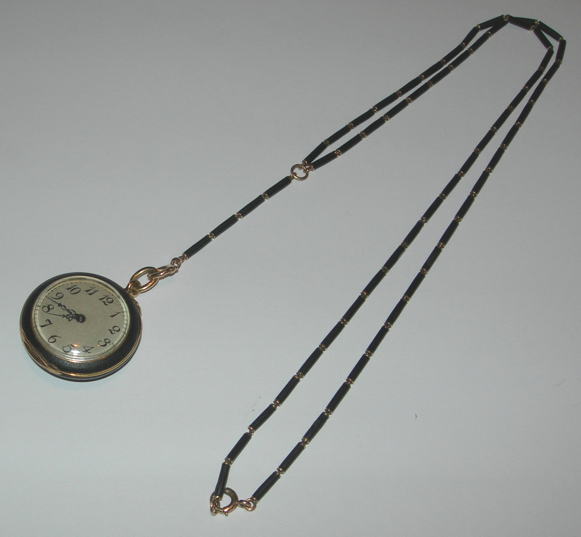 WALTHAM - an open faced fob watch with chain,
