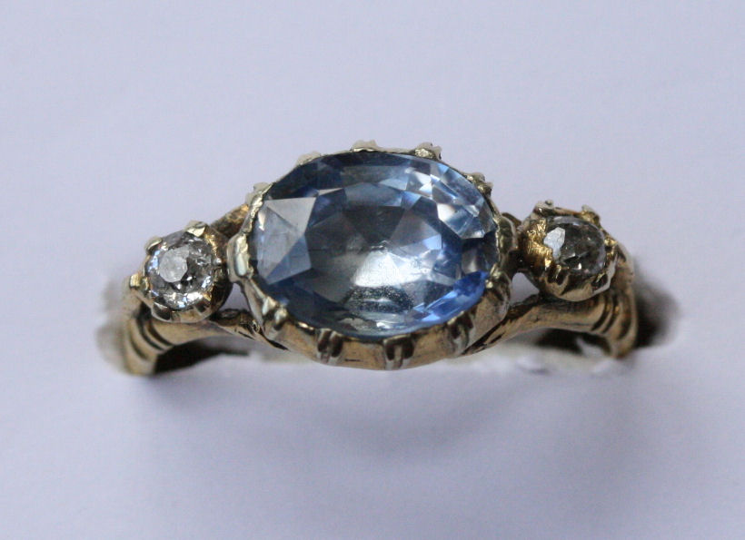 An early 19th century sapphire and diamond set three-stone ring