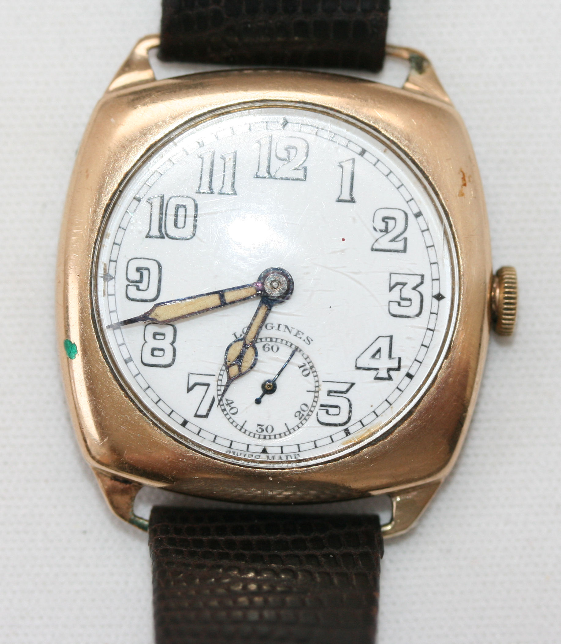 LONGINES - a 1940's 9ct gold gentleman's wrist watch,