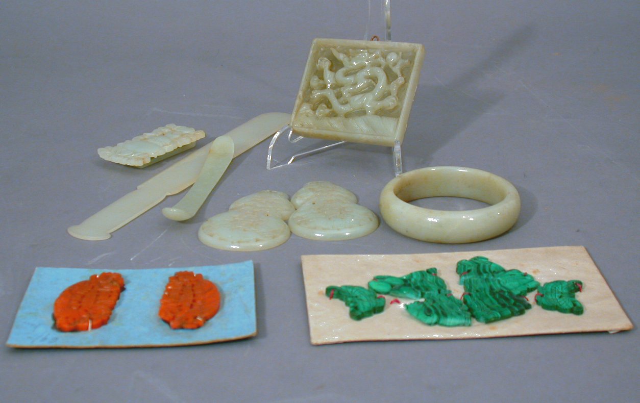 A Chinese carved pale spinach jade letter opener