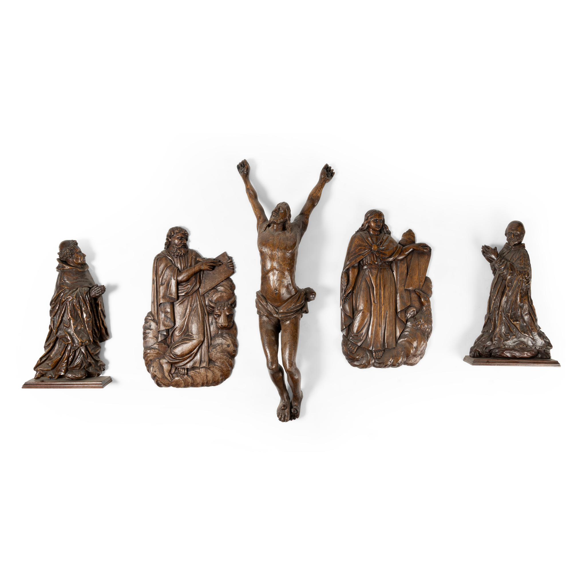 A GROUP OF FIVE CARVED OAK RELIGIOUS FIGURES