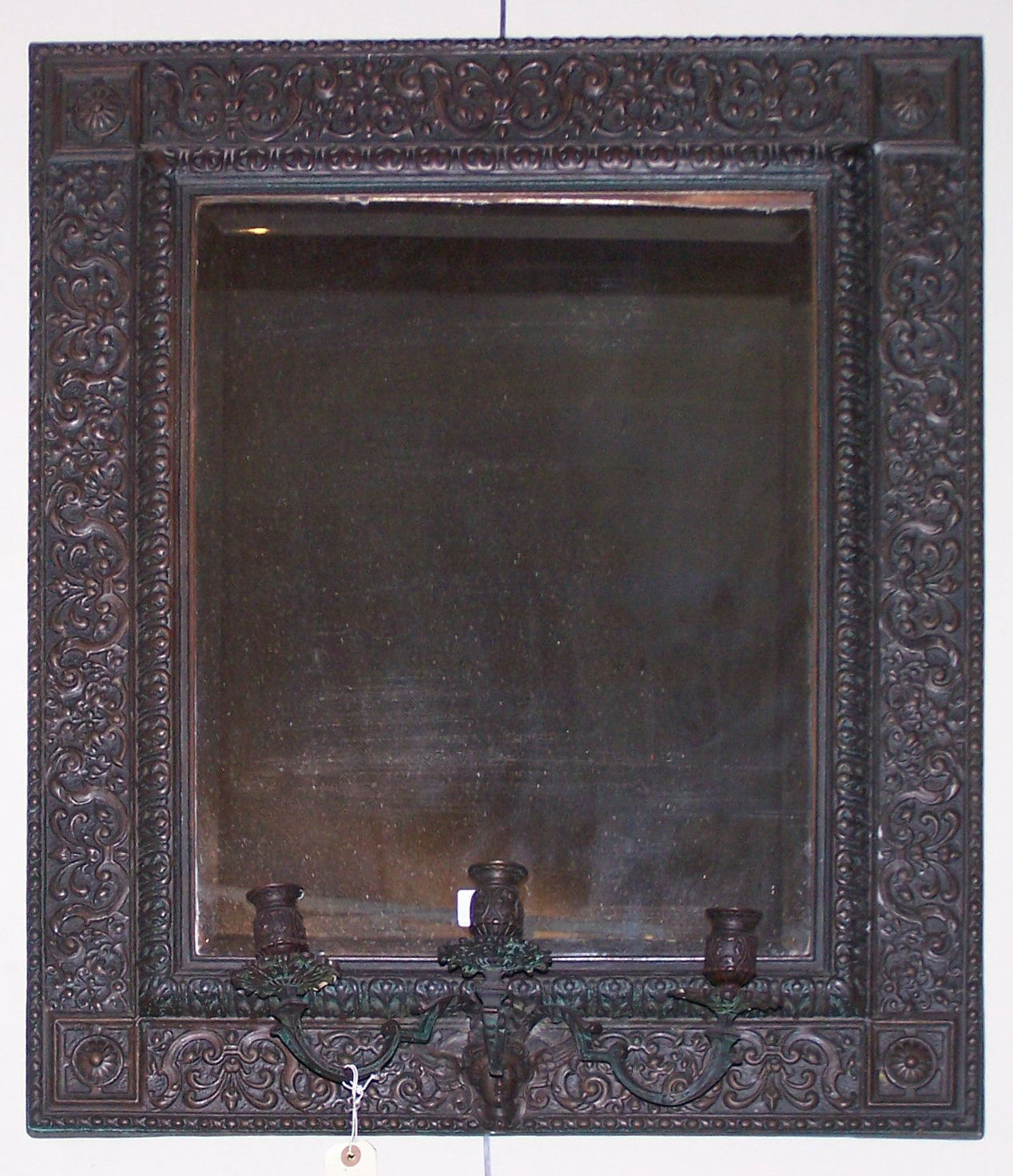 A 19th century repousee brass wall mirror,