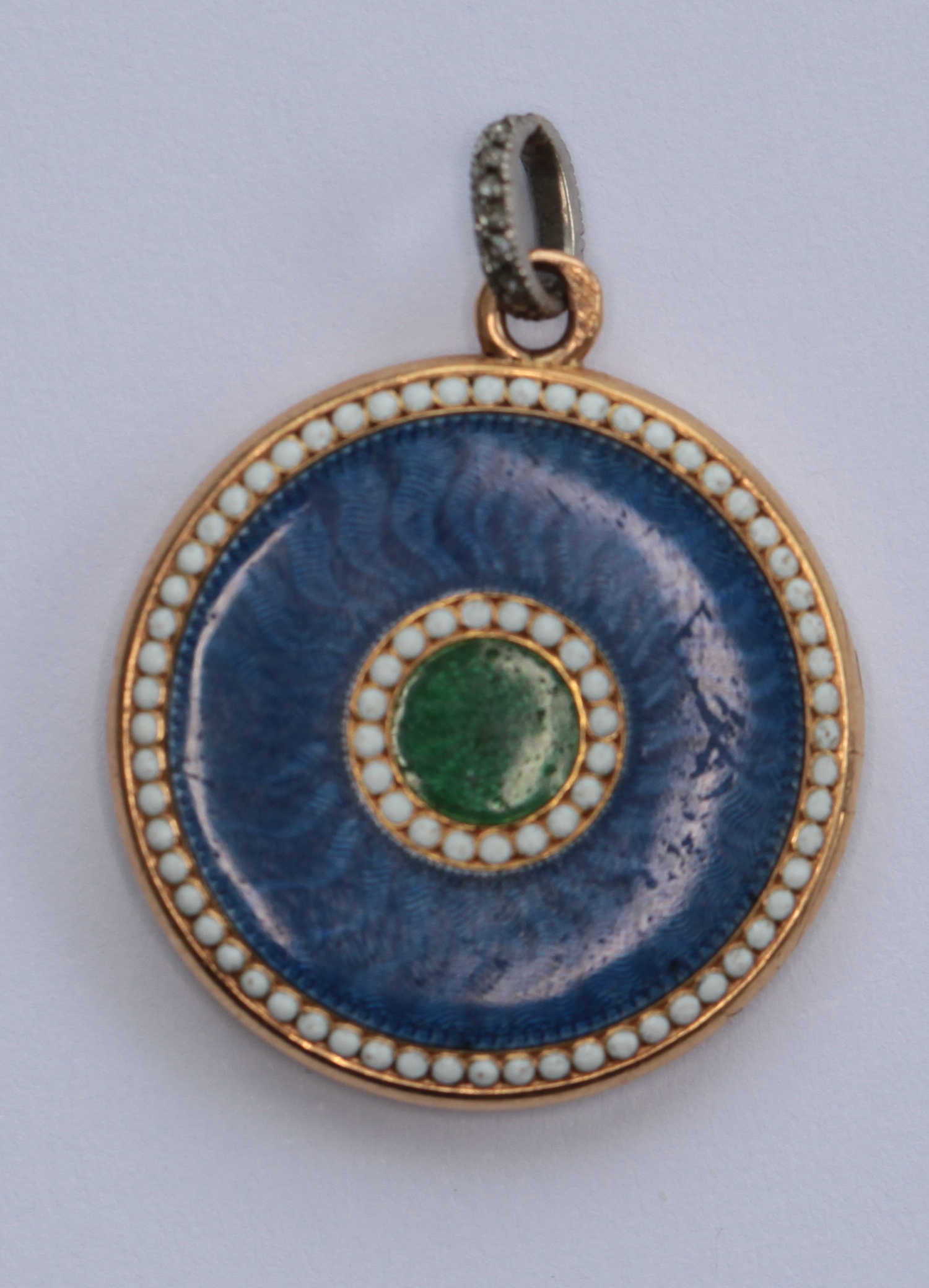 CARTIER - a gold and enamel locket